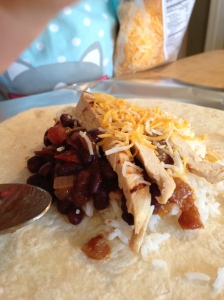 A little bit of everything in these burritos: rice, beans, chicken and cheese