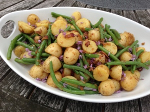 A dish welcome at any cook out: new potatoes and green beans dressed with a bacon/shallot/vinegar dressing