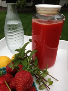 A pitcher of Strawberry Lemonade concentrate...and some fizzy water to mix with it